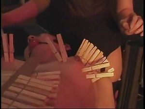 BDSM bitch drips hot wax on petite bondaged Asian with red ball in mouth